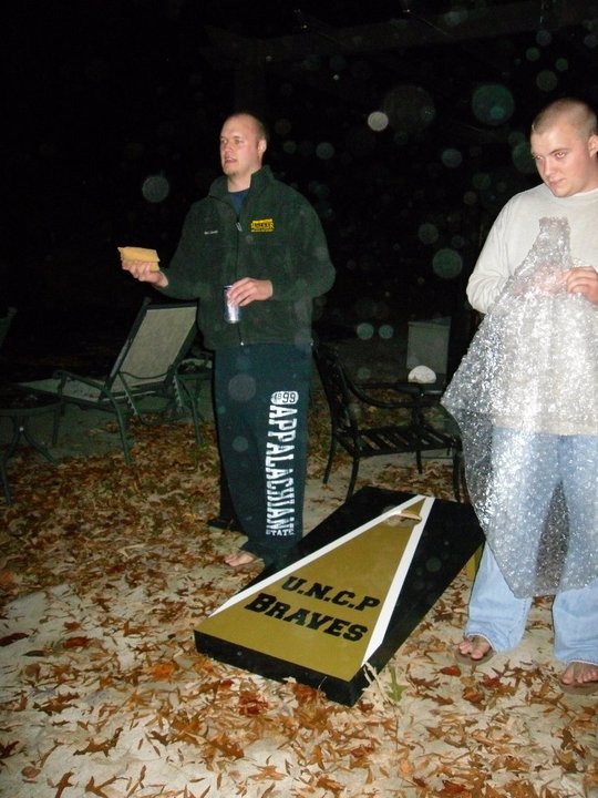 brett & his brother & his new cornhole set